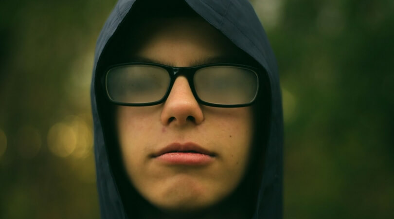Teen in Hoodie with Foggy Glasses