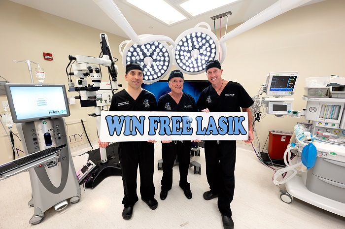 Eye doctors holding win free lasik sign