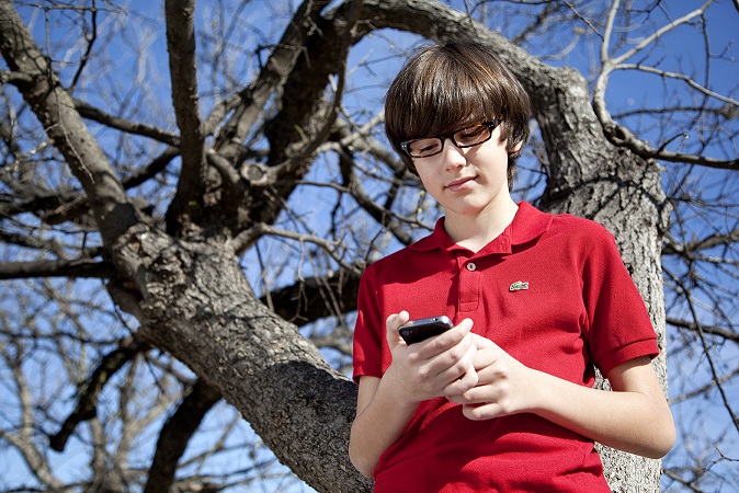 Young Man Using Computer Glasses for Phone