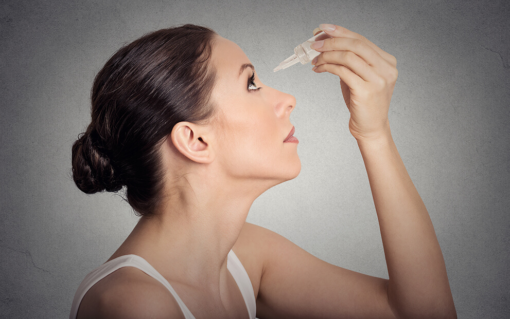 Woman with eyedrops