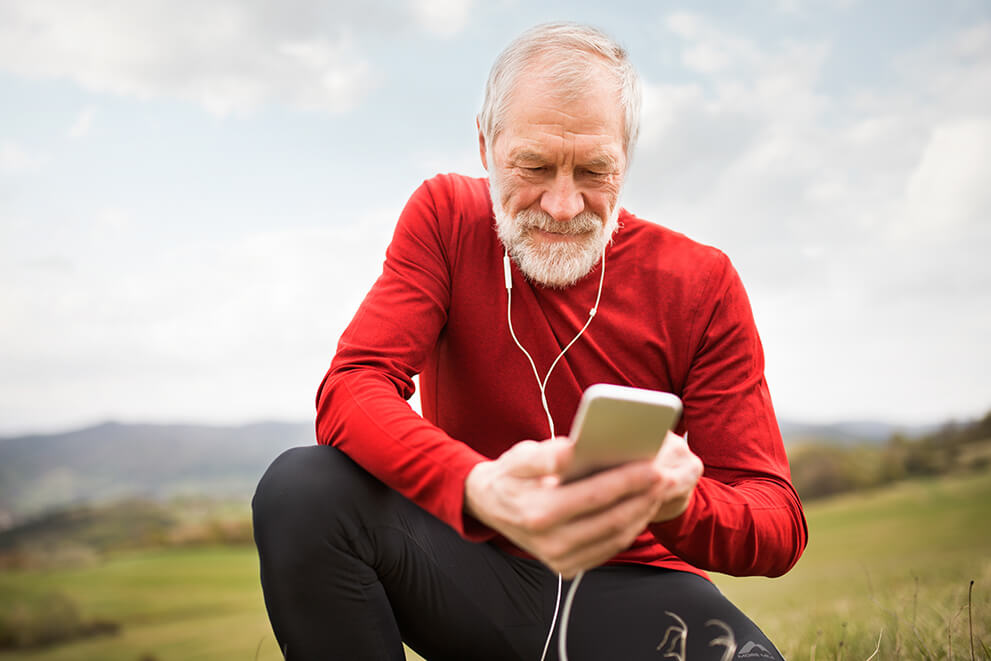 Senior runner with smart phone