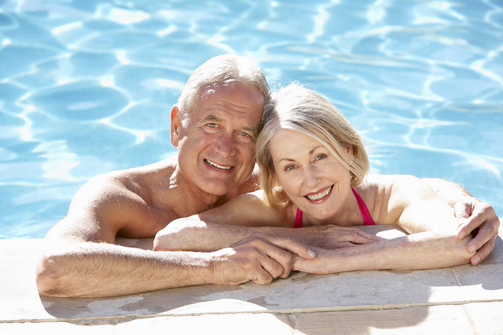 Senior Couple in a Pool Older Couple In Pool