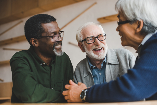 Men with glasses smiling