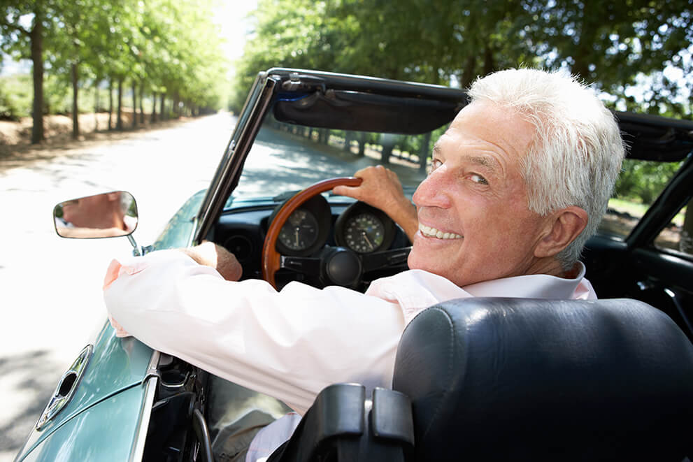 older man in convertible